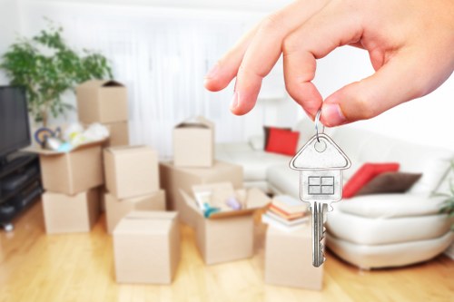Furniture pick-up service handling a sofa in Hammersmith