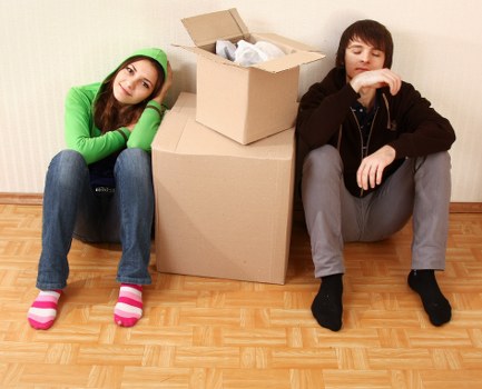 Packed moving boxes and furniture ready for transport in Hammersmith