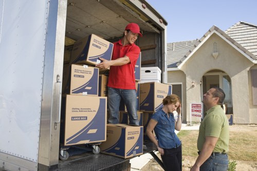 Professional movers loading a van for a house relocation in Hammersmith