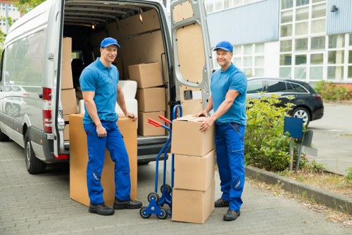 Professional movers handling stairs during a flat removal in Hammersmith