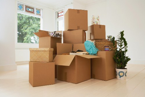 Packed boxes and labelled office items ready for commercial removals