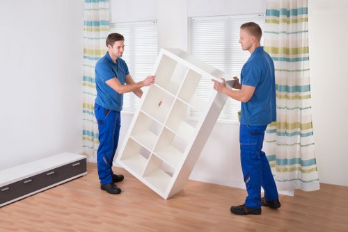 Professional man and van helping with furniture transport in Hammersmith