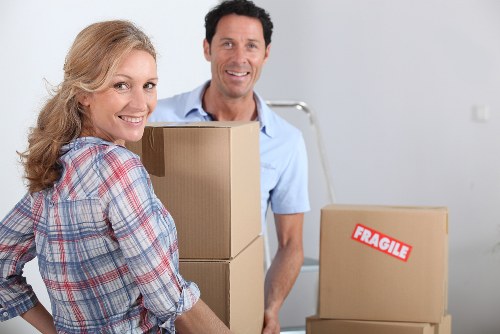 Professional movers carrying student furniture in London